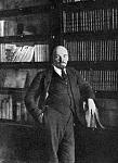 V. I. Lenin by his books in the Kremlin office.