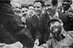 Bobby Fischer shaking hands with Fidel Castro, behind Castro is Tigran Petrosian and behind him is Cuban chess champion  Rogelio Ortega