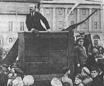 Lenin giving a speech to troops leaving for the polish front. Trotsky and Kamenev are to his left on the stairs